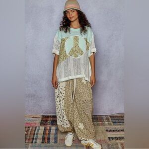 46. NWOT POL Multicolor Peace Sign Top